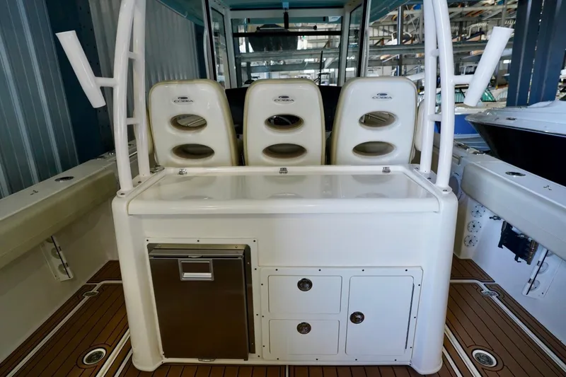 Slide: The Image of 2019 Cobia 344 Center Console boat interior with seating and storage compartments. - 8