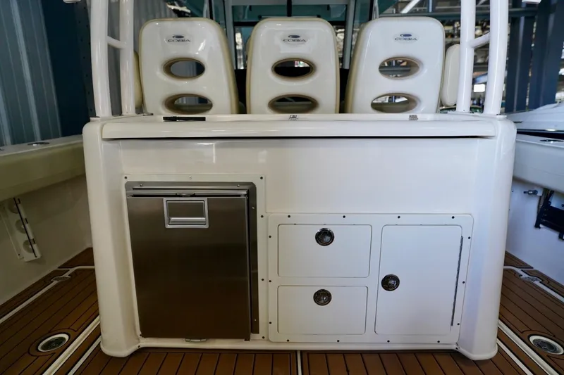 Slide: The Image of 2019 Cobia 344 Center Console boat interior with seating and storage compartments. - 9