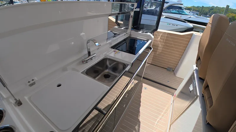 Slide: The Image of The 2027 Saxdor 400 GTS features a modern kitchenette with a sink and cooktop. - 16