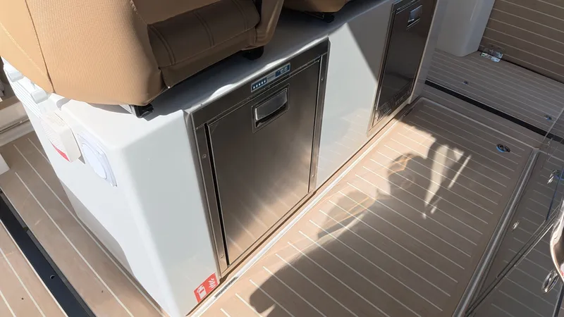 Slide: The Image of The 2027 Saxdor 400 GTS features a modern interior with sleek seating and a built-in refrigerator. - 17