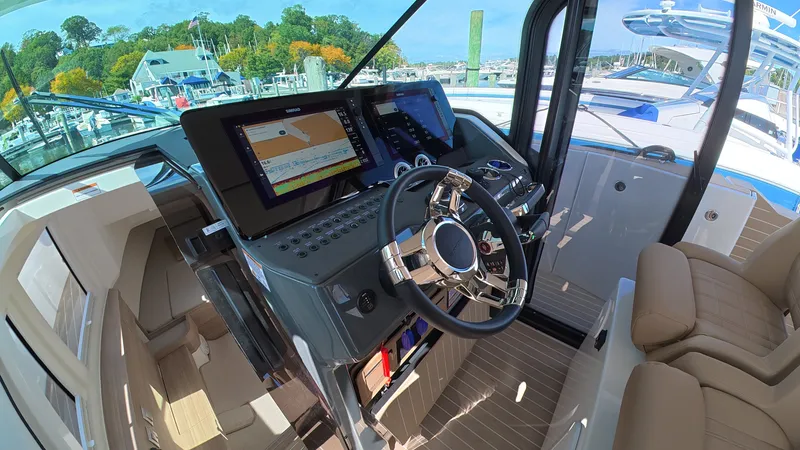 Slide: The Image of The 2027 Saxdor 400 GTS cockpit features modern navigation systems and comfortable seating. - 22
