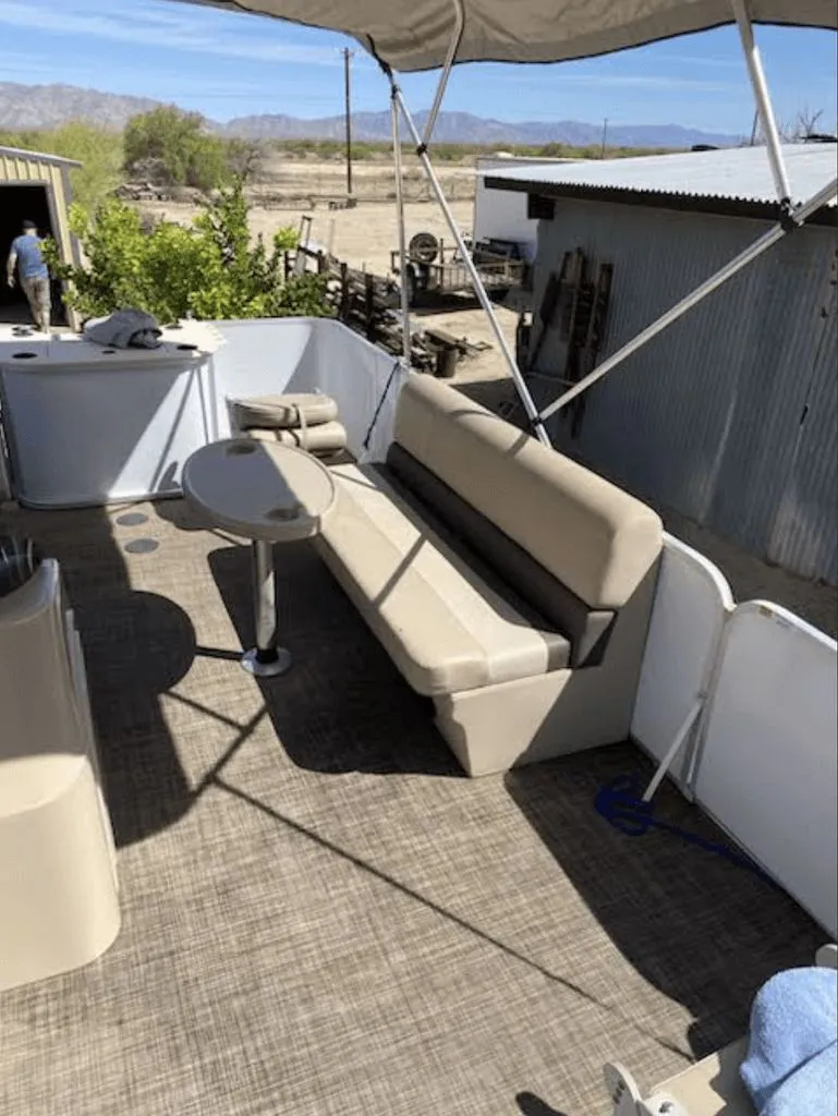 Slide: The Image of Interior of a 2019 SunCatcher 18F Pontoon with seating area. - 7