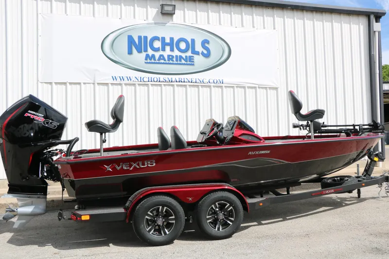 The Image of 2026 Vexus AVX 1985s boat in red, parked at Nichols Marine dealership. - 0