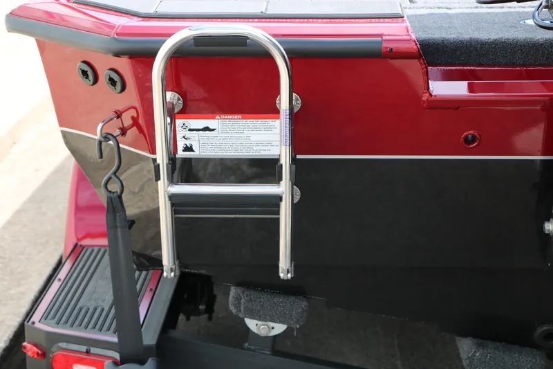 Slide: The Image of Rear view of 2026 Vexus AVX 1985s boat with ladder and warning label. - 10