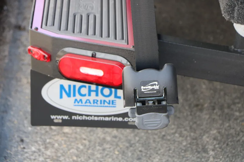 Slide: The Image of 2026 Vexus AVX 1985s trailer with BoatBuckle and Nichol Marine branding. - 11