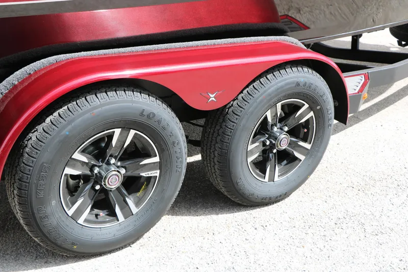 Slide: The Image of Red Vexus AVX 1985s 2026 trailer with black alloy wheels and Loadstar tires. - 17