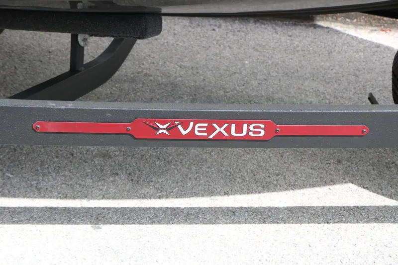 Slide: The Image of 2026 Vexus AVX 1985s trailer with red logo on pavement background. - 18