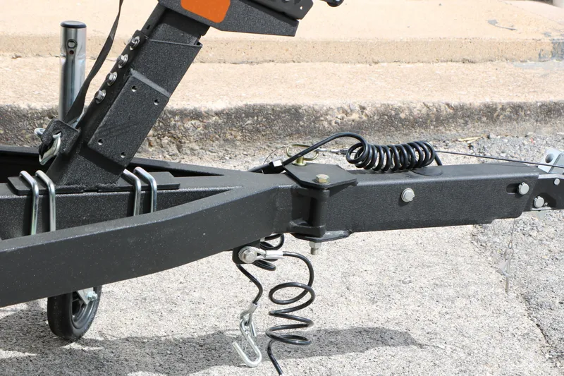 Slide: The Image of Trailer hitch of 2026 Vexus AVX 1985s on pavement background. - 20