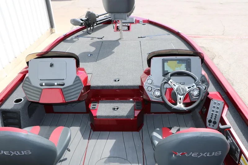 Slide: The Image of 2026 Vexus AVX 1985s boat interior with steering wheel and navigation display. - 24