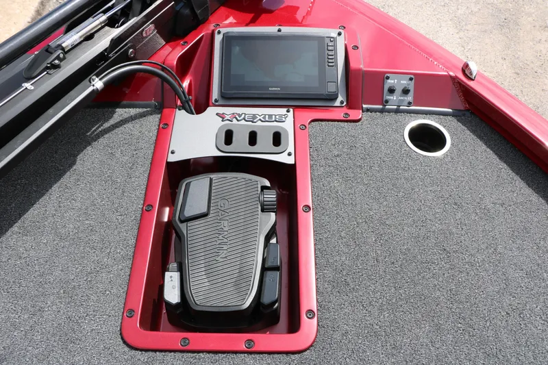 Slide: The Image of 2026 Vexus AVX 1985s boat dashboard with Garmin device and control panel. - 25