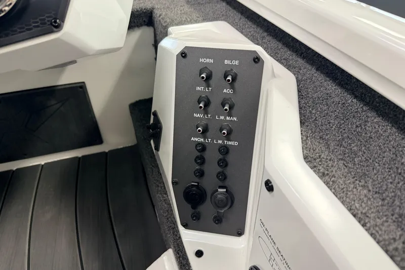 Slide: The Image of Control panel of 2026 Vexus AVX 1985s boat with switches and outlets. - 10