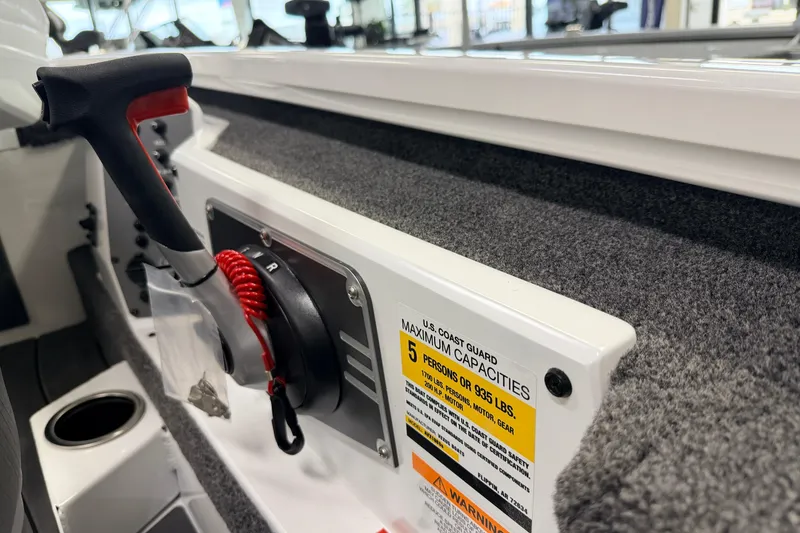 Slide: The Image of Control panel of 2026 Vexus AVX 1985s boat with capacity warning label. - 11