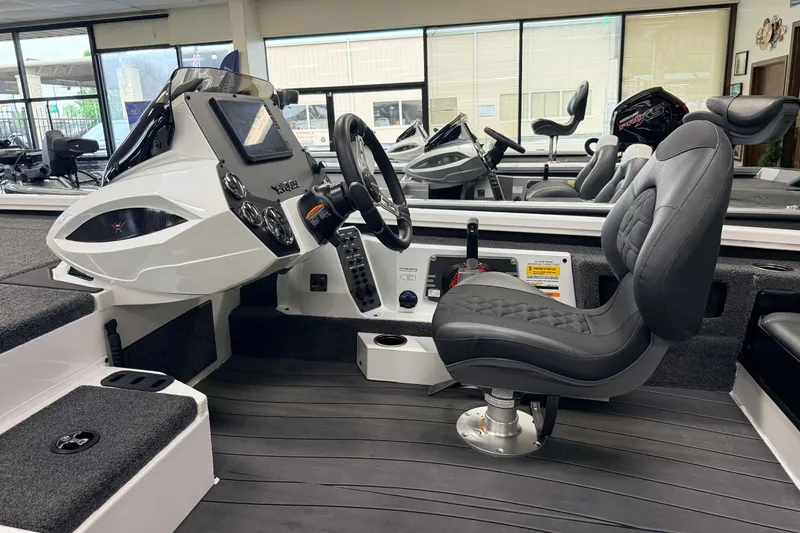 Slide: The Image of 2026 Vexus AVX 1985s boat interior with modern dashboard and comfortable seating. - 12
