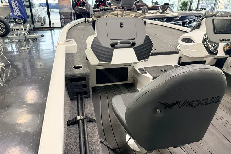 Slide: The Image of 2026 Vexus AVX 1985s boat interior with seating and control panel in showroom. - 15