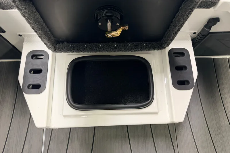 Slide: The Image of Interior view of 2026 Vexus AVX 1985s boat compartment with storage and control panel. - 17