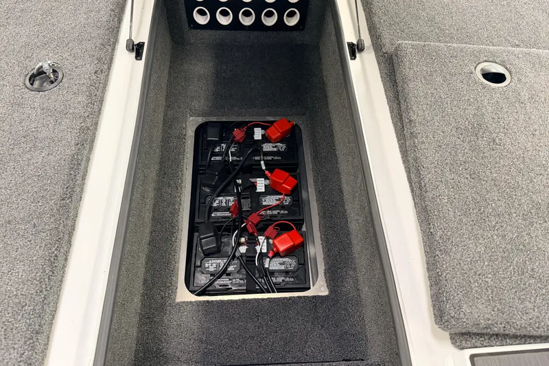 Slide: The Image of Battery compartment of 2026 Vexus AVX 1985s boat, featuring multiple batteries and wiring. - 20