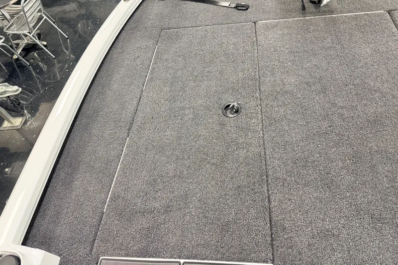 Slide: The Image of Carpeted deck of 2026 Vexus AVX 1985s boat with storage compartment. - 21