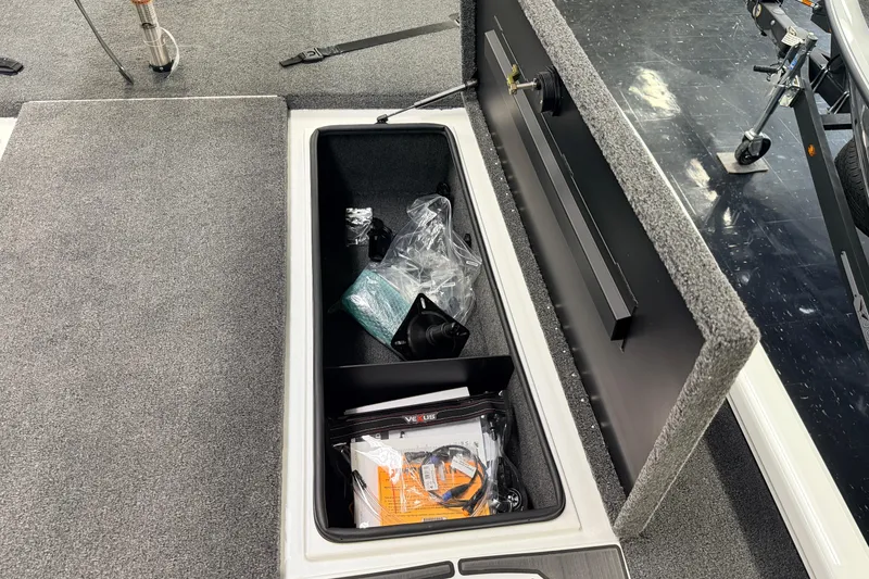 Slide: The Image of Storage compartment of 2026 Vexus AVX 1985s boat with accessories inside. - 24