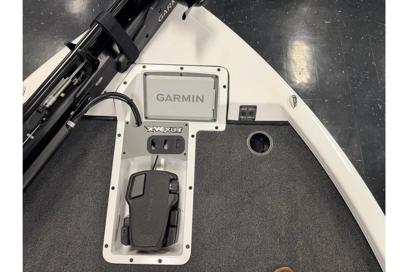 Slide: The Image of 2026 Vexus AVX 1985s boat deck with Garmin electronics and foot pedal controls. - 26
