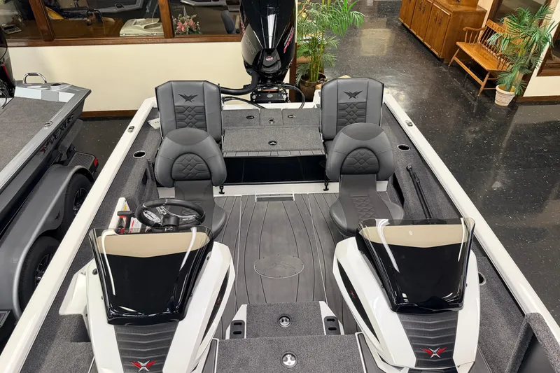 Slide: The Image of 2026 Vexus AVX 1985s boat interior with dual consoles and seating. - 30