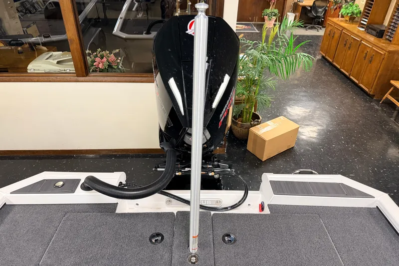 Slide: The Image of 2026 Vexus AVX 1985s boat interior with motor, showroom setting. - 33