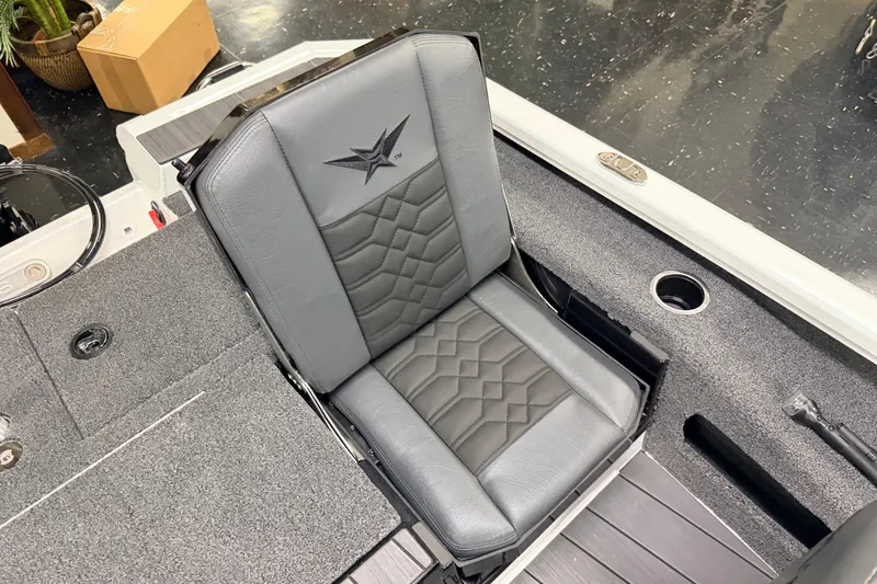 Slide: The Image of 2026 Vexus AVX 1985s boat seat with sleek gray upholstery and embroidered logo. - 36