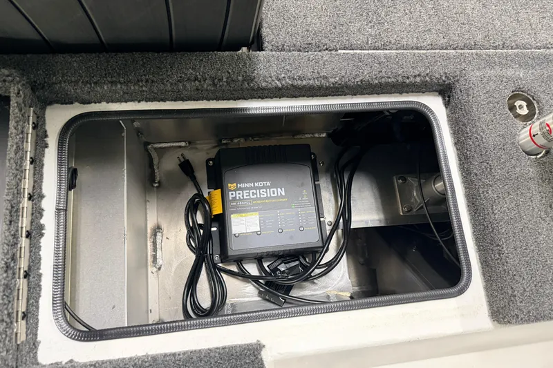 Slide: The Image of Minn Kota Precision charger in Vexus AVX 1985s boat compartment, 2026 model. - 39