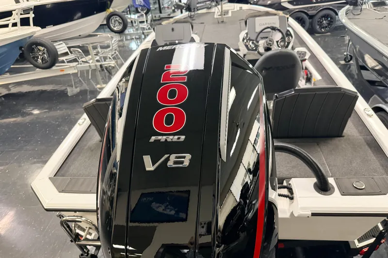 Slide: The Image of 2026 Vexus AVX 1985s boat with Mercury 200 Pro V8 engine in showroom. - 4