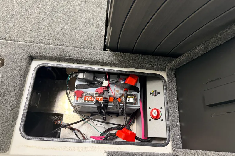 Slide: The Image of Battery compartment of 2026 Vexus AVX 1985s boat, featuring Pro Guide battery. - 40