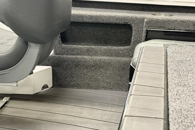 Slide: The Image of Interior of 2026 Vexus AVX 1985s boat with gray seating and carpeted surfaces. - 42