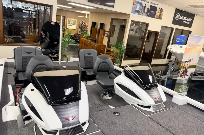 Slide: The Image of 2026 Vexus AVX 1985s boat interior with dual consoles and seating in showroom. - 44