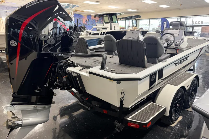 Slide: The Image of 2026 Vexus AVX 1985s boat with powerful Mercury Pro XS engine in showroom. - 5