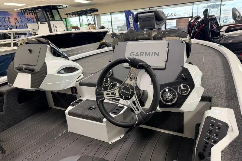 Slide: The Image of 2026 Vexus AVX 1985s boat interior with Garmin navigation and modern steering console. - 6