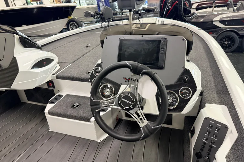 Slide: The Image of 2026 Vexus AVX 1985s boat interior with steering wheel and control panel. - 7