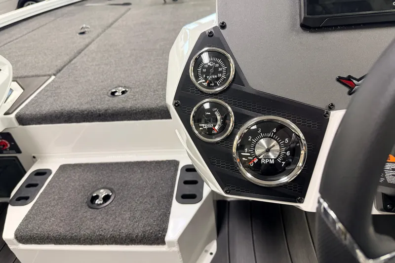Slide: The Image of 2026 Vexus AVX 1985s boat dashboard with RPM, trim, and water temperature gauges. - 9