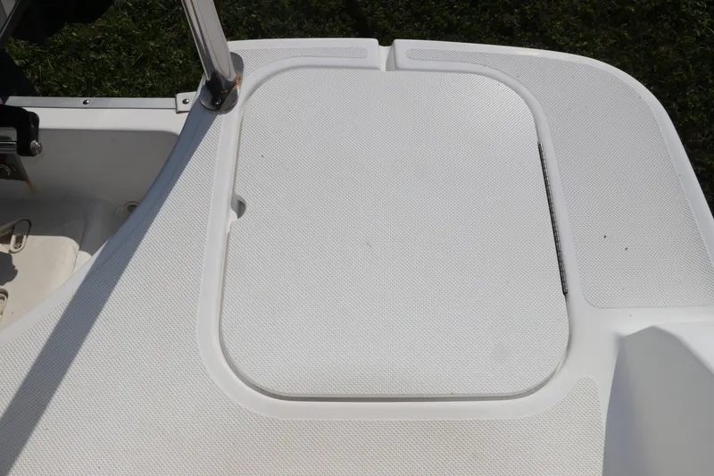 Slide: The Image of 2016 Hurricane SunDeck 2486 OB boat deck with storage hatch. - 11