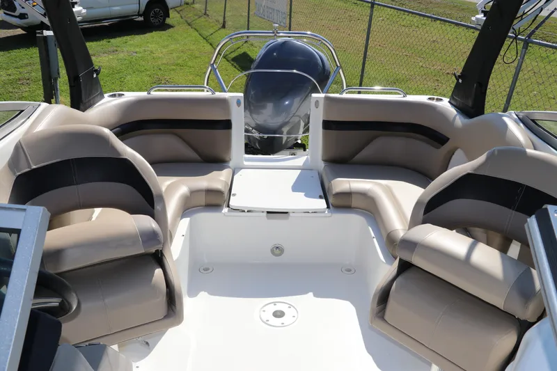 Slide: The Image of 2016 Hurricane SunDeck 2486 OB boat interior with spacious seating and modern design. - 13