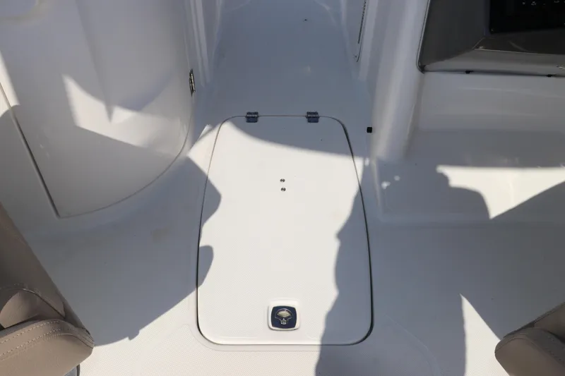 Slide: The Image of 2016 Hurricane SunDeck 2486 OB boat interior with storage compartment. - 19