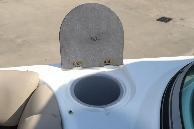 Slide: The Image of 2016 Hurricane SunDeck 2486 OB boat detail with open storage compartment. - 22