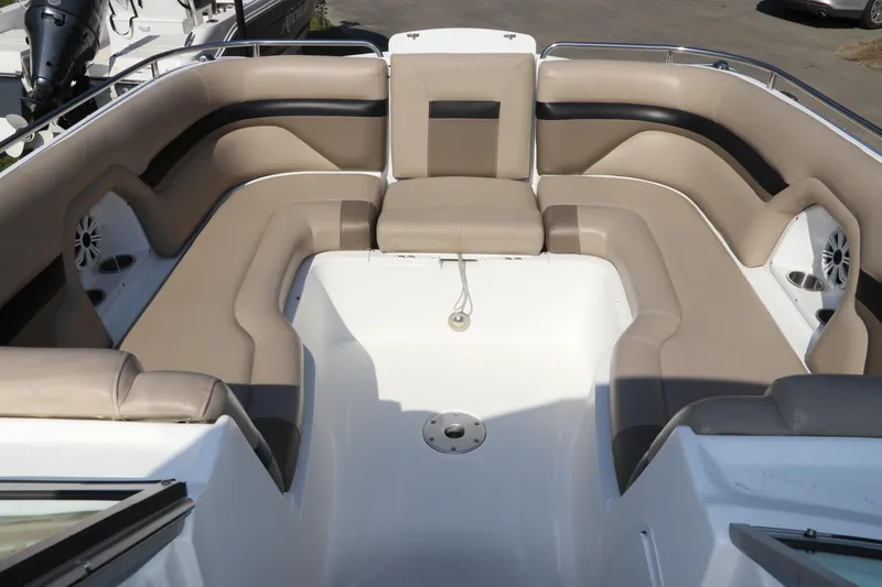 Slide: The Image of 2016 Hurricane SunDeck 2486 OB boat interior with spacious seating and modern design. - 24