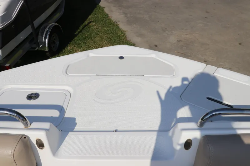 Slide: The Image of 2016 Hurricane SunDeck 2486 OB boat deck with seating and storage compartments. - 25