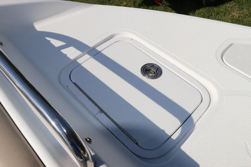 Slide: The Image of 2016 Hurricane SunDeck 2486 OB boat hatch with stainless steel railing. - 30