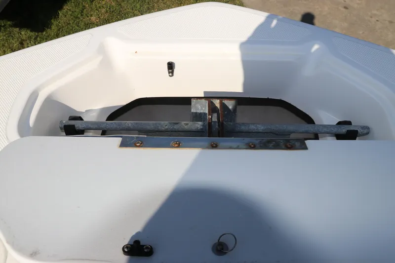 Slide: The Image of 2016 Hurricane SunDeck 2486 OB boat storage compartment with metal fittings. - 33
