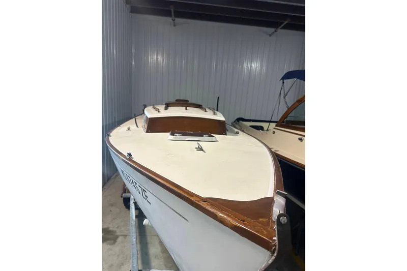 Slide: The Image of 1998 Bridges Point BP 24 sailboat in storage facility. - 5