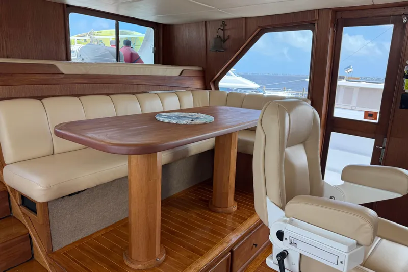 Slide: The Image of Helm of 1997 Real Ships 61' Islander with Garmin navigation equipment and classic wooden design. - 12