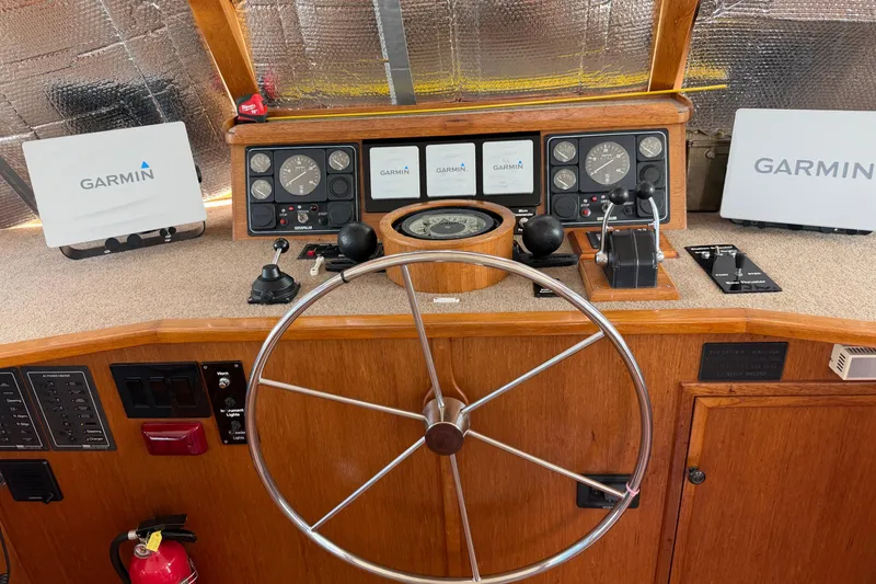 Slide: The Image of Cozy bedroom on 1997 Real Ships 61' Islander with patchwork quilt and desk area. - 14