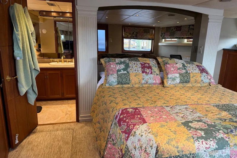 Slide: The Image of Bathroom vanity on 1997 Real Ships 61' Islander with marble countertop and gold fixtures. - 17