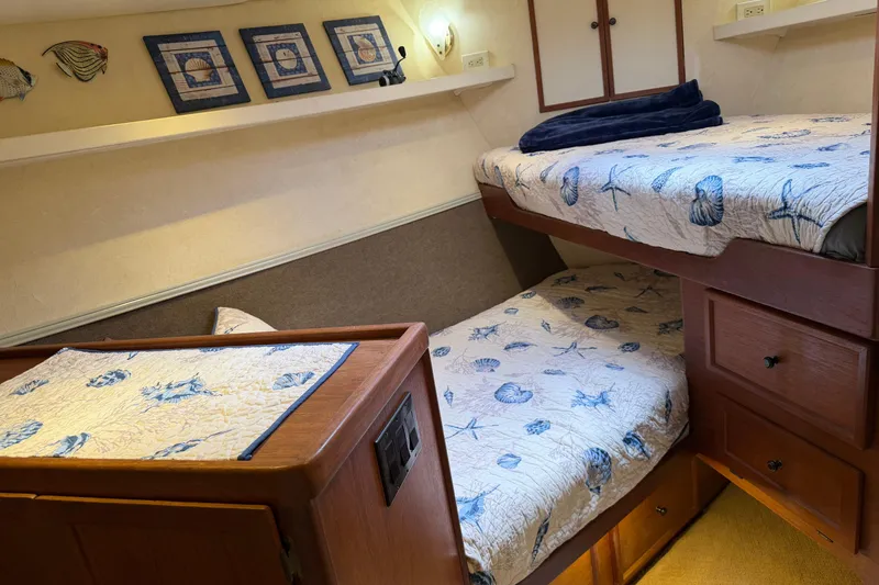 Slide: The Image of Cozy twin cabin with floral decor on 1997 Real Ships 61' Islander yacht. - 21