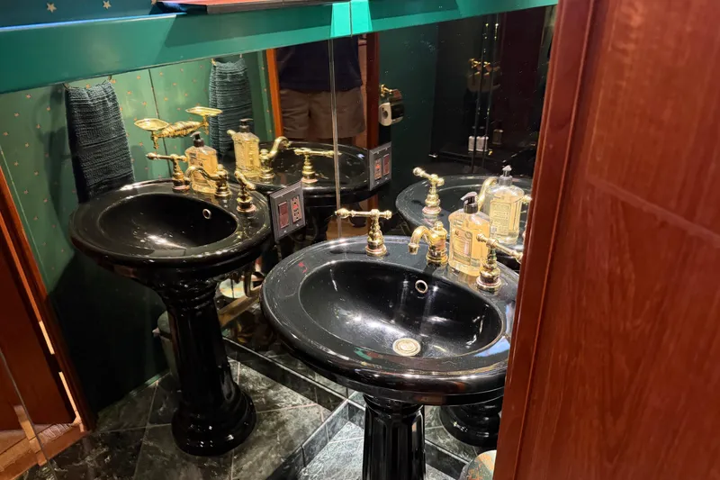 Slide: The Image of Bathroom with white towels on a rack in a 1997 Real Ships 61' Islander. - 22