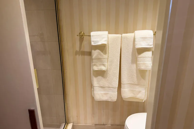 Slide: The Image of Luxurious black sink with gold fixtures in 1997 Real Ships 61' Islander yacht bathroom. - 24